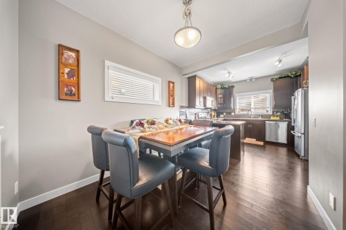 Dining space featuring dark wood-style flooring - 8107 224 Street Nw, Edmonton, AB - Indoor Photo Showing Dining Room