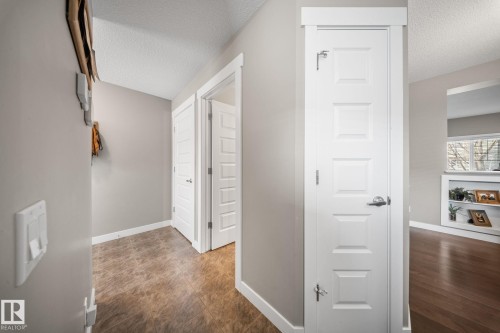 Hallway featuring a textured ceiling - 8107 224 Street Nw, Edmonton, AB - Indoor Photo Showing Other Room