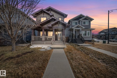 Craftsman-style house featuring a porch and a yard - 8107 224 Street Nw, Edmonton, AB - Outdoor With Deck Patio Veranda With Facade