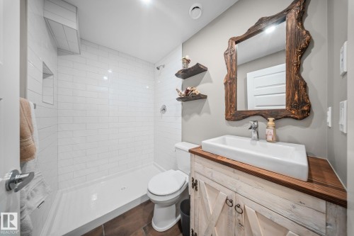Bathroom featuring tiled shower and vanity - 8107 224 Street Nw, Edmonton, AB - Indoor Photo Showing Bathroom
