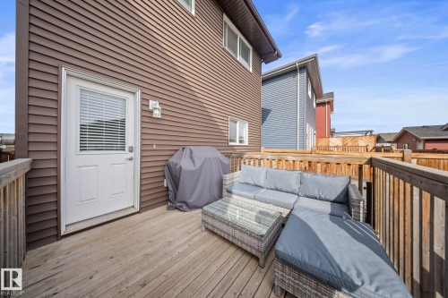 Wooden deck featuring a grill and outdoor seating - 8107 224 Street Nw, Edmonton, AB - Outdoor With Deck Patio Veranda With Exterior