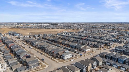 Aerial view of property and surrounding area with nearby suburban area - 8107 224 Street Nw, Edmonton, AB - Outdoor With View