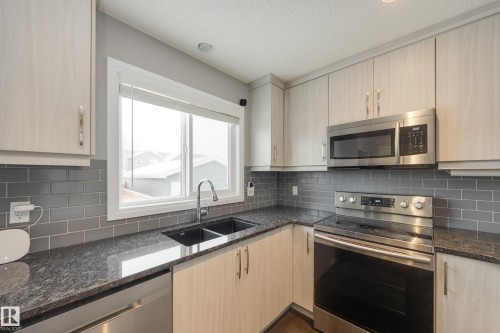 232 Southfork Drive, Leduc, AB - Indoor Photo Showing Kitchen With Double Sink