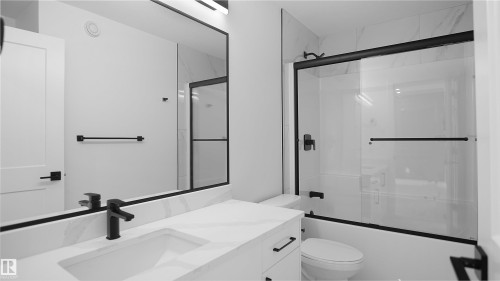 Full bath with shower / bath combination with glass door and vanity - 711 31 Avenue, Edmonton, AB - Indoor Photo Showing Bathroom