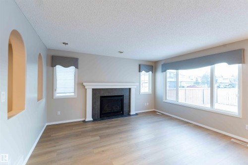 11211 11 Ave, Edmonton, AB - Indoor Photo Showing Living Room With Fireplace