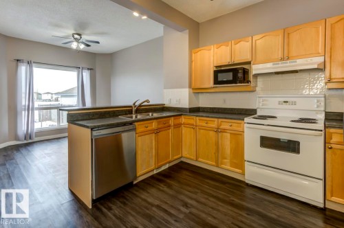 187 Bridgeport Boulevard, Leduc, AB - Indoor Photo Showing Kitchen With Double Sink