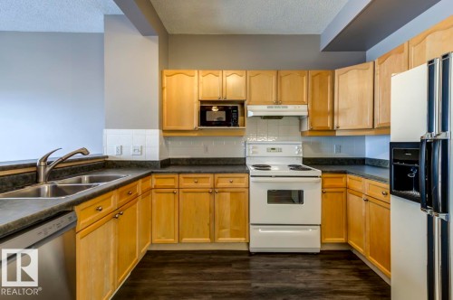 187 Bridgeport Boulevard, Leduc, AB - Indoor Photo Showing Kitchen With Double Sink