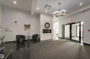 403 1350 Windermere Way, Edmonton, AB  - Indoor Photo Showing Other Room With Fireplace 