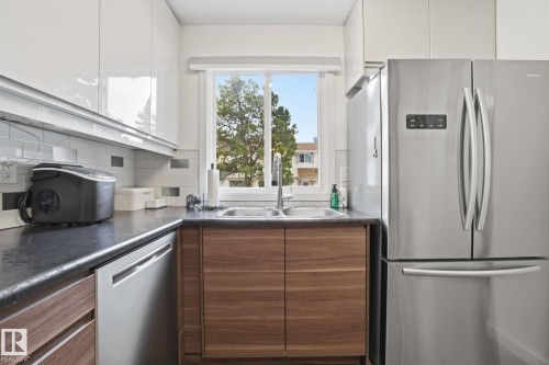 15016 51 Street, Edmonton, AB - Indoor Photo Showing Kitchen With Double Sink