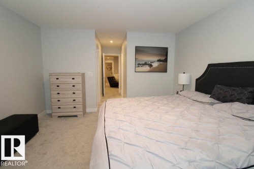 Bedroom featuring light colored carpet and baseboards - 22140 81 Avenue, Edmonton, AB - Indoor Photo Showing Bedroom