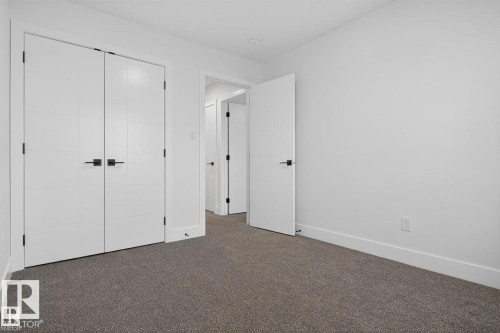Unfurnished bedroom with carpet floors and a closet - 47 River Birch Way, St. Albert, AB - Indoor Photo Showing Other Room