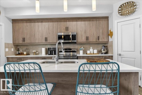 290 Rolston Wynd, Leduc, AB - Indoor Photo Showing Kitchen With Double Sink