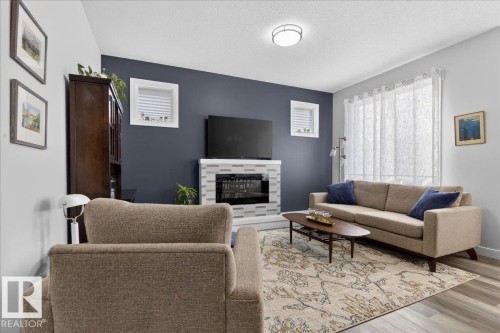 290 Rolston Wynd, Leduc, AB - Indoor Photo Showing Living Room With Fireplace