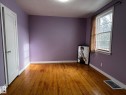 Spare room with hardwood / wood-style flooring - 10830 68 Avenue, Edmonton, AB  - Indoor Photo Showing Other Room 