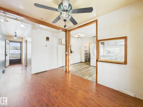 Empty room with wood finished floors and ceiling fan - 13523 124B Avenue, Edmonton, AB - Indoor Photo Showing Other Room