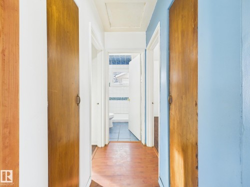 Hall with wood finished floors - 13523 124B Avenue, Edmonton, AB - Indoor Photo Showing Other Room