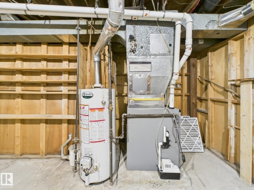 Utilities with gas water heater and heating unit - 13523 124B Avenue, Edmonton, AB - Indoor Photo Showing Basement