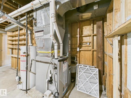 Utility room with water heater and heating unit - 13523 124B Avenue, Edmonton, AB - Indoor Photo Showing Basement