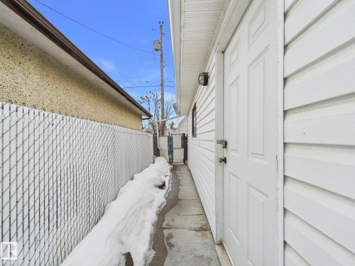 View of property exterior featuring a gate - 13523 124B Avenue, Edmonton, AB - Outdoor With Exterior