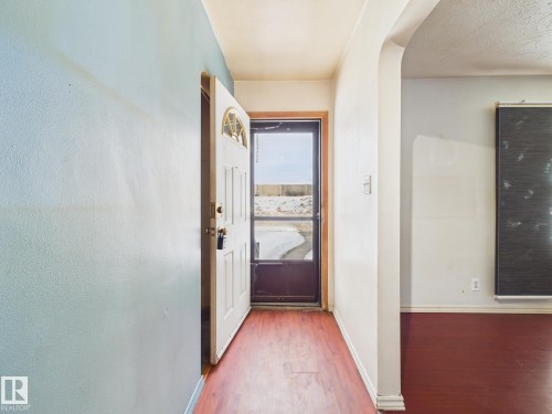 Corridor with wood finished floors and baseboards - 13523 124B Avenue, Edmonton, AB - Indoor Photo Showing Other Room