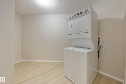 404 6070 Schonsee Way, Edmonton, AB - Indoor Photo Showing Laundry Room