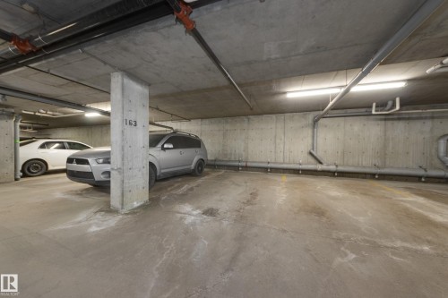 404 6070 Schonsee Way, Edmonton, AB - Indoor Photo Showing Garage