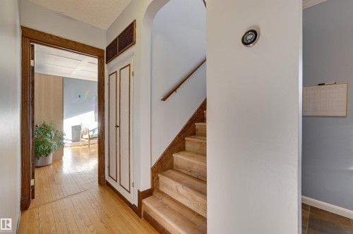 Stairs with baseboards and hardwood / wood-style floors - 10911 66 Avenue, Edmonton, AB - Indoor Photo Showing Other Room