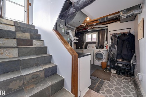 Laundry area with washing machine and clothes dryer and heating unit - 10911 66 Avenue, Edmonton, AB - Indoor