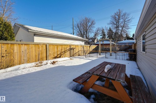 Snowy yard featuring a fenced backyard - 10911 66 Avenue, Edmonton, AB - Outdoor