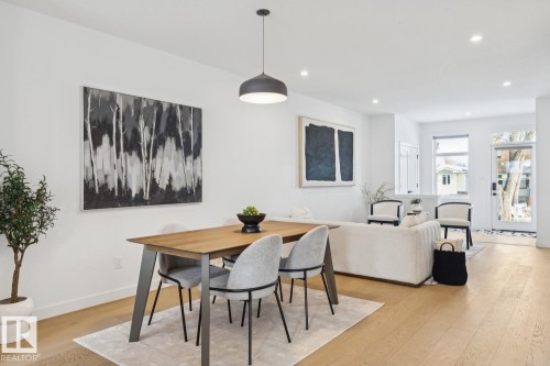 Dining room with light wood-type flooring and recessed lighting - 11016 132 Street, Edmonton, AB - Indoor