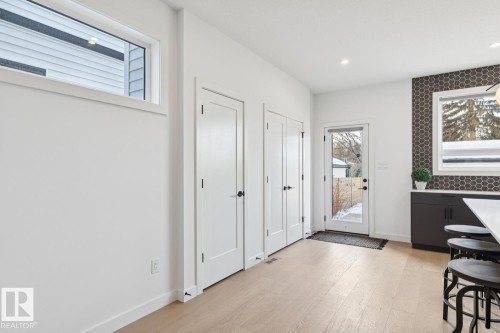 Entrance foyer featuring light wood finished floors and recessed lighting - 11016 132 Street, Edmonton, AB - Indoor Photo Showing Other Room