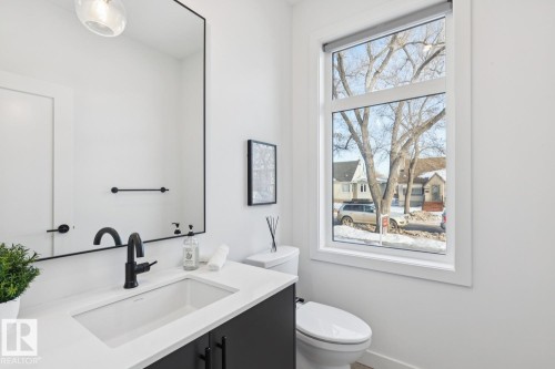 Bathroom with toilet and vanity - 11016 132 Street, Edmonton, AB - Indoor Photo Showing Bathroom