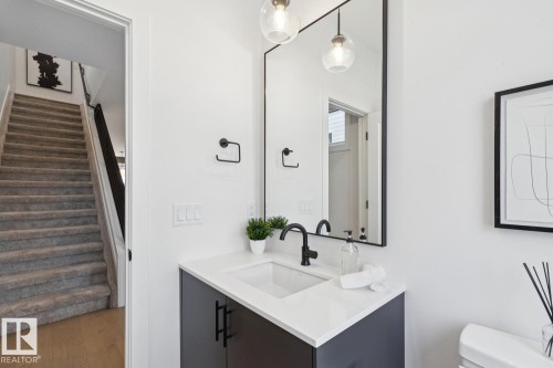 Bathroom featuring vanity and wood finished floors - 11016 132 Street, Edmonton, AB - Indoor Photo Showing Bathroom