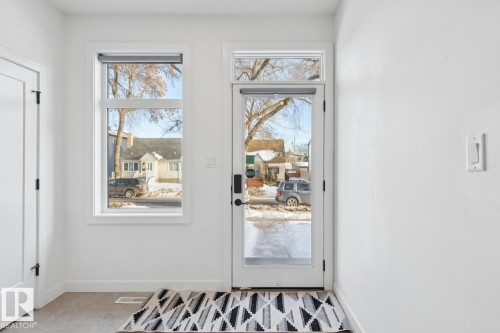 Doorway featuring baseboards - 11016 132 Street, Edmonton, AB - Indoor Photo Showing Other Room