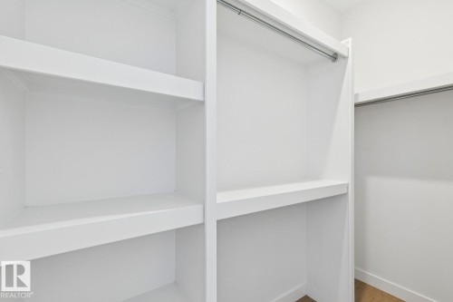 Walk in closet featuring wood finished floors - 11016 132 Street, Edmonton, AB - Indoor With Storage