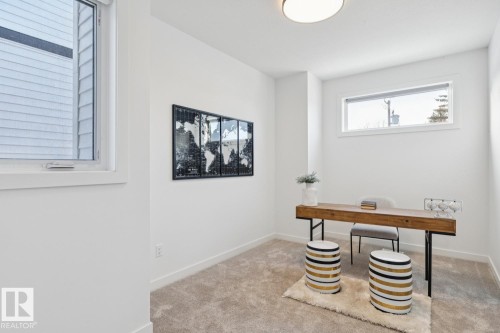 Carpeted home office with baseboards - 11016 132 Street, Edmonton, AB - Indoor