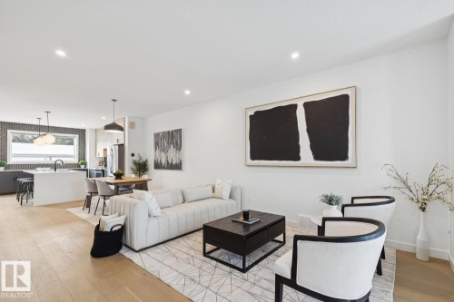 Living room featuring light wood-type flooring and recessed lighting - 11016 132 Street, Edmonton, AB - Indoor Photo Showing Living Room