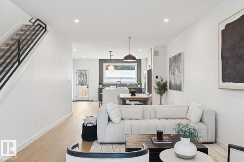 Living area with recessed lighting and light wood finished floors - 11016 132 Street, Edmonton, AB - Indoor Photo Showing Living Room