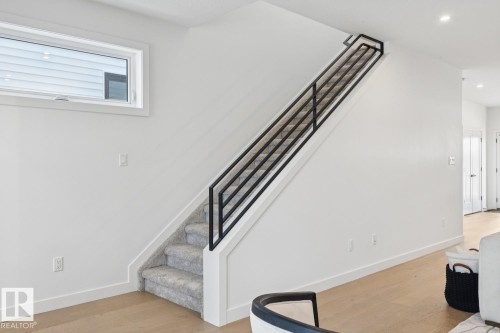 Stairs featuring wood finished floors and recessed lighting - 11016 132 Street, Edmonton, AB - Indoor Photo Showing Other Room