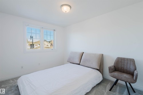 Carpeted bedroom featuring baseboards - 3547 Mclay Crescent, Edmonton, AB - Indoor Photo Showing Bedroom