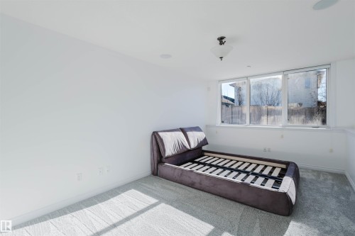 Bedroom featuring carpet and baseboards - 3547 Mclay Crescent, Edmonton, AB - Indoor Photo Showing Bedroom