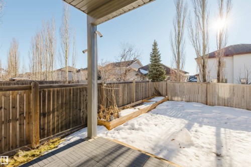 Wooden terrace with a fenced backyard - 3547 Mclay Crescent, Edmonton, AB - Outdoor With Exterior