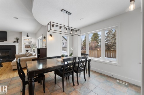 74 Linksview Drive, Spruce Grove, AB - Indoor Photo Showing Dining Room With Fireplace
