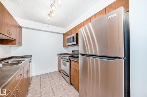 304 10303 105 Street, Edmonton, AB - Indoor Photo Showing Kitchen With Double Sink