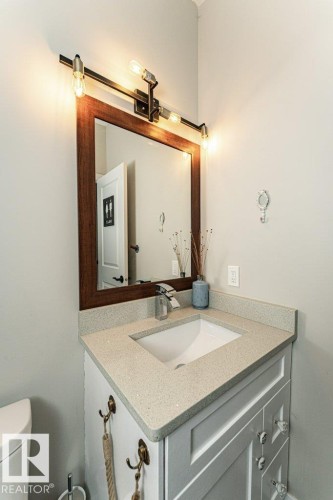 Half bath featuring vanity and toilet - 10535 67 Avenue, Edmonton, AB - Indoor