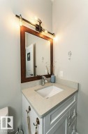 Half bath featuring vanity and toilet - 