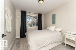 Bedroom with carpet flooring and a textured ceiling - 