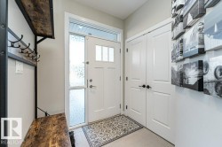 Entrance foyer featuring light tile patterned floors - 