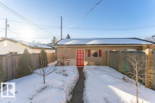 View of front of house with a fenced backyard - 10535 67 Avenue, Edmonton, AB - Outdoor With Deck Patio Veranda