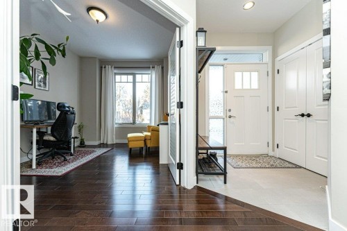Entryway featuring wood finished floors and healthy amount of natural light - 10535 67 Avenue, Edmonton, AB - Indoor Photo Showing Other Room
